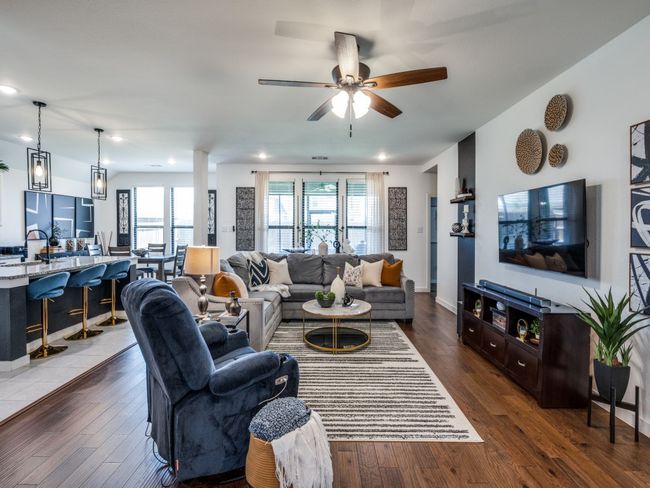 Living room featuring wood-type flooring, a ceiling fan, baseboards, and recessed lighting | Image 10
