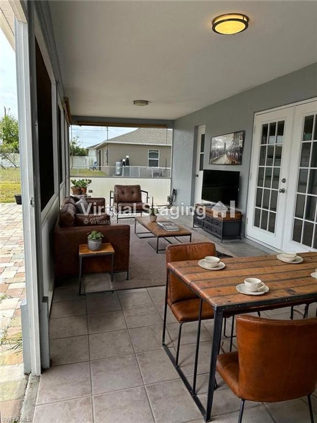 Sunroom / solarium featuring french doors and healthy amount of natural light | Image 21