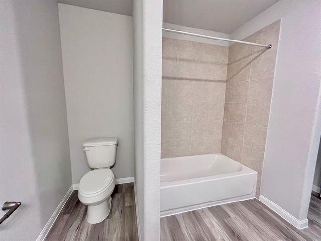 Elegant master bath with updated fixtures and modern design. Virtually staged for inspiration. | Image 25