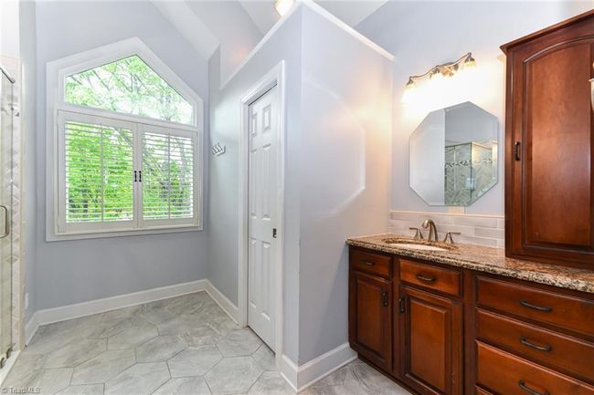 Primary bath offers separate vanities | Image 16