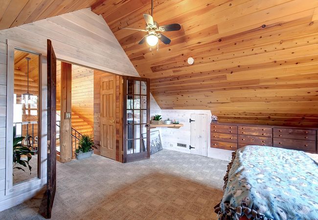 Upper level bedroom #3. Note the french style doors | Image 36