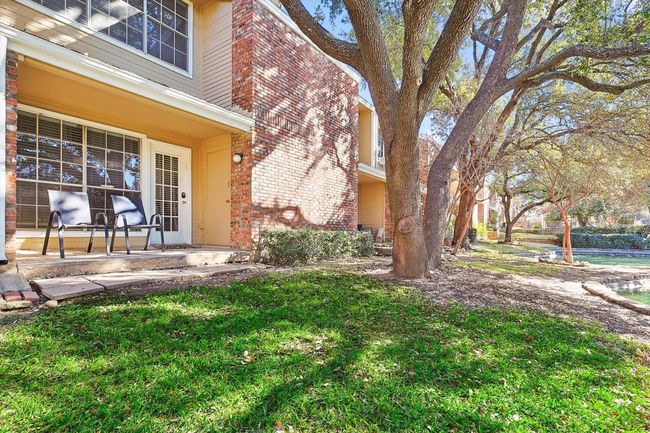 View of green space behind condo featuring a patio area | Image 14
