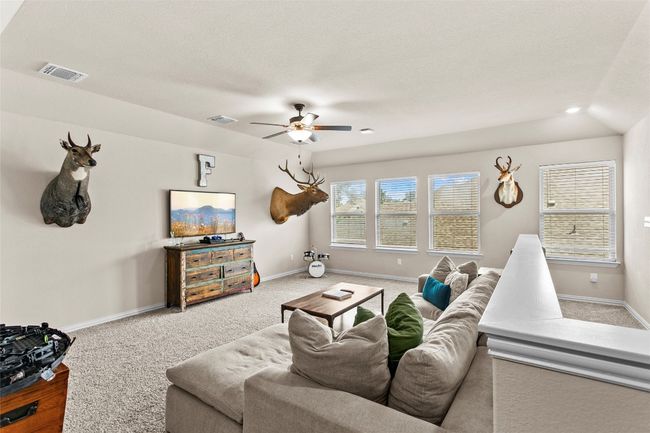 Living area featuring a ceiling fan, carpet floors, and recessed lighting | Image 26