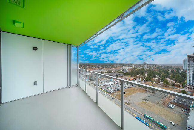 Balcony with visible vents and a city view | Image 21