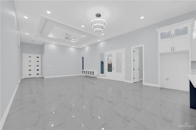 Open Concept living room featuring baseboards, recessed lighting, porcelain finish floor, Italian Inspired design Modern fixtures and Superior Led Lighting | Image 11