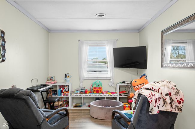 rec room featuring wood finished floors and visible vents | Image 22
