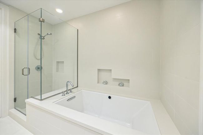 This shows the jetted tub and shower. | Image 20