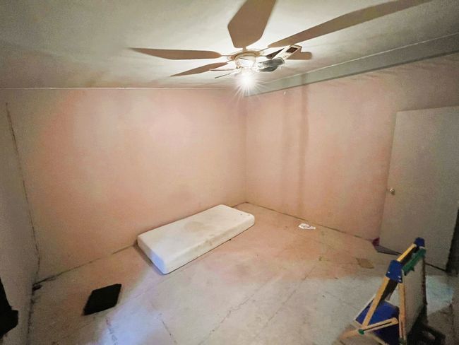 Spare room featuring a ceiling fan | Image 19