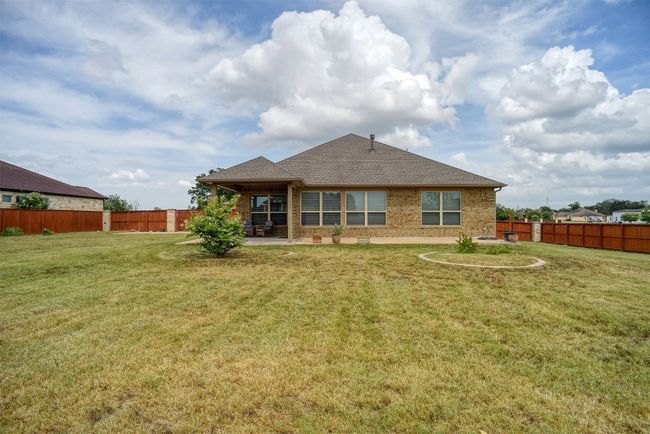 Rear view of house featuring a patio area and fenced backyard | Image 32