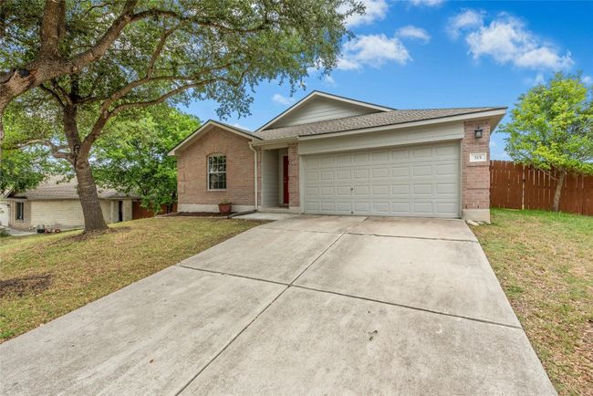 Ranch-style home with brick siding, driveway, an attached garage, and a shingled roof | Image 30