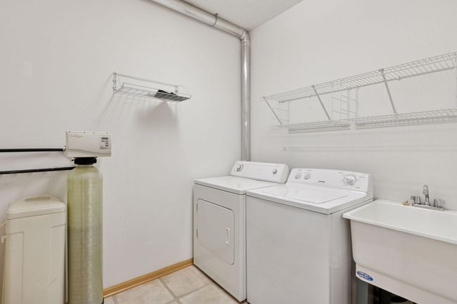 A convenient laundry room located off the kitchen | Image 35