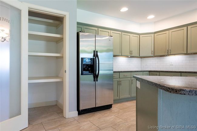 Wooden shelving in "Pantry". | Image 61