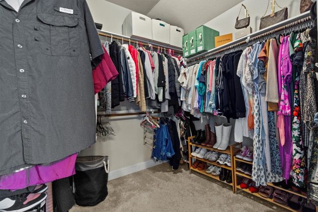 Spacious closet with carpet flooring | Image 24