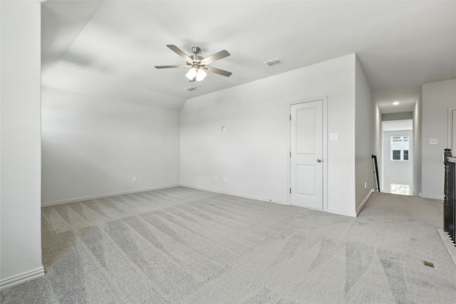 Carpeted spare room with ceiling fan and baseboards | Image 26