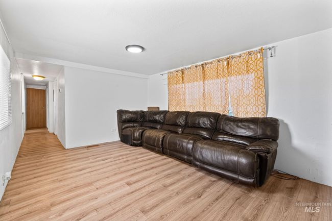 Living area with light wood-style flooring | Image 6