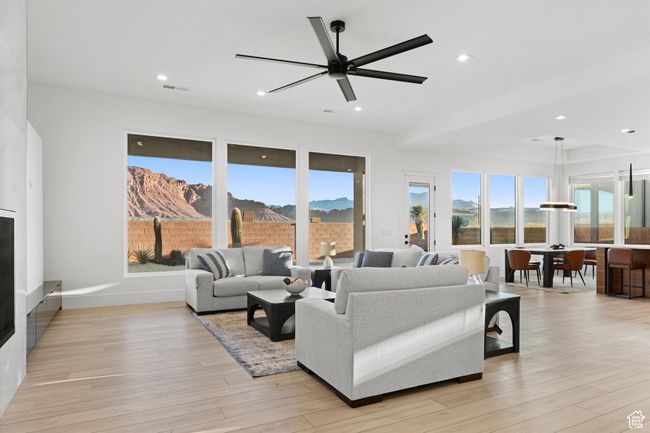 Living area with recessed lighting, light wood-style flooring, visible vents, and ceiling fan | Image 6