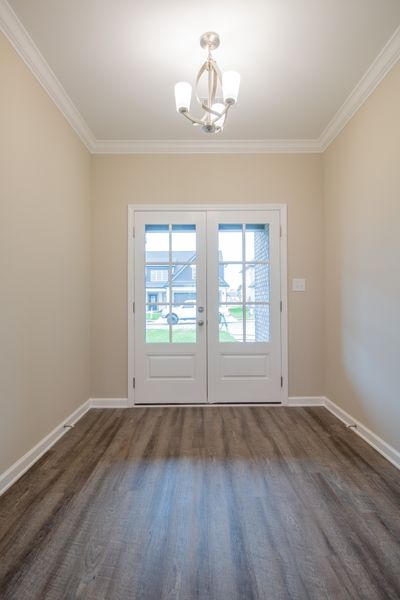 Spacious Entry Foyer with French Doors, Wood Flooring, and an Elegant Chandelier! | Image 3