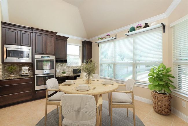 This end of the kitchen offers a data desk area and breakfast nook | Image 19