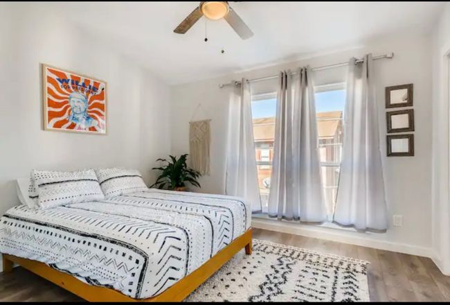 Bedroom with wood finished floors, baseboards, and ceiling fan | Image 14