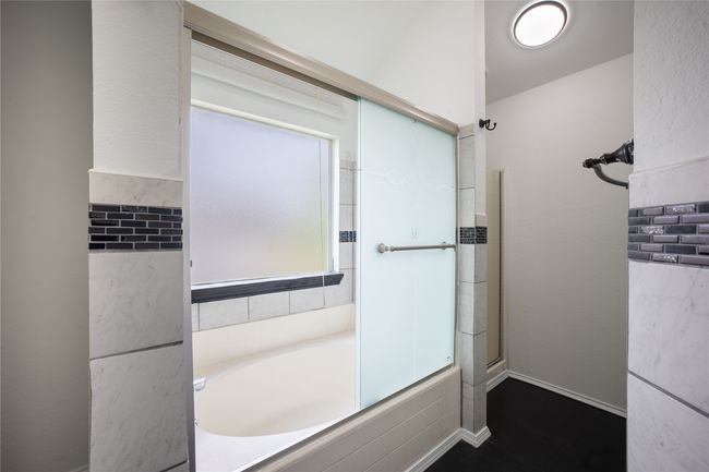 Full bath with a bath, baseboards, and walk in shower | Image 9