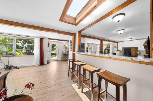 Main Home - View from the hallway - barstool overlooking the kitchen. | Image 14