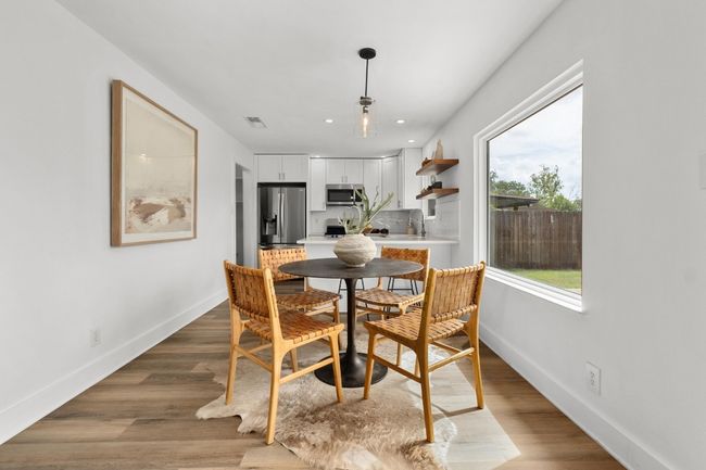 Dining space featuring recessed lighting and wood finished floors | Image 6