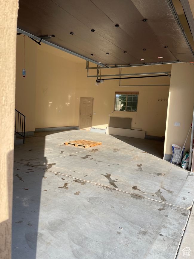 Garage featuring a garage door opener | Image 7