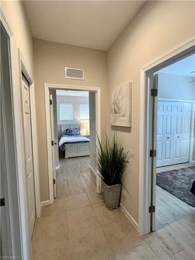 Hall to guest bath, and 2 guest bedrooms | Image 30