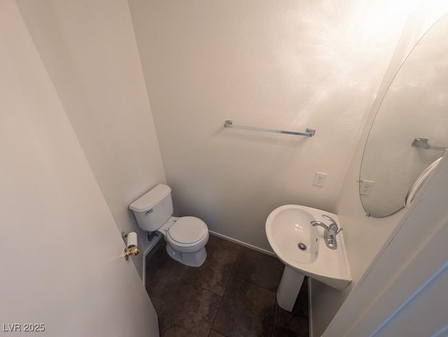 Half bathroom featuring tile patterned floors and toilet | Image 10