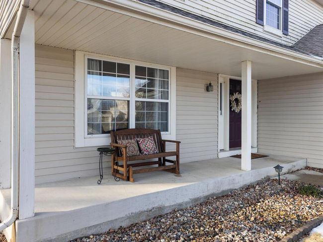 Cozy front porch to enjoy morning coffee or an evening beverage | Image 8