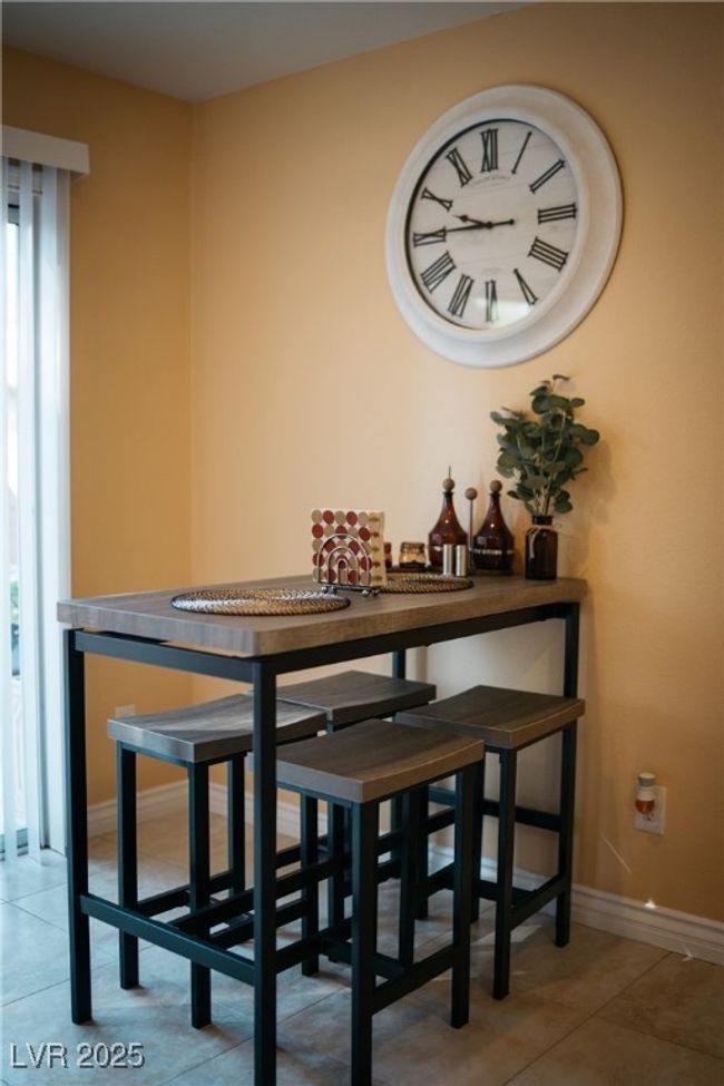 Tiled dining space with baseboards | Image 7