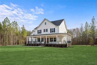 View of front of home featuring a porch and a front yard | Image 2