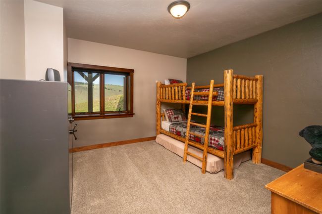 Carpeted bedroom with baseboards | Image 22