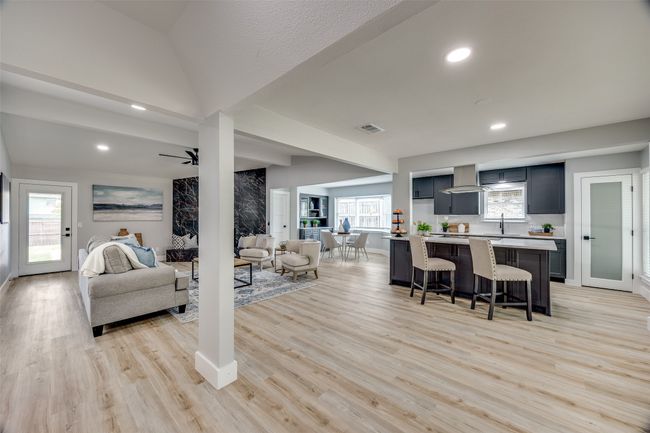 Living room featuring light wood-type flooring, recessed lighting, and ceiling fan | Image 10