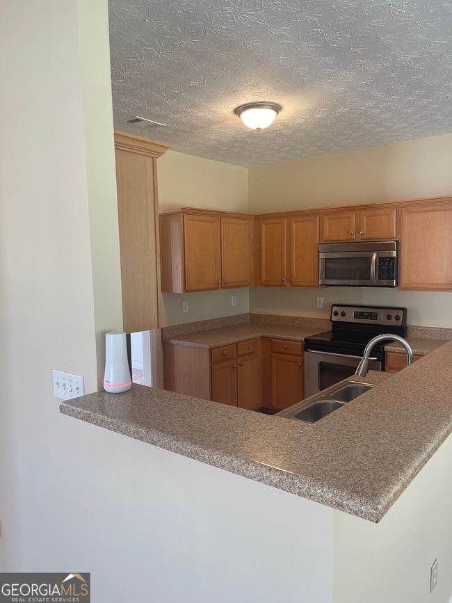 2645 Santa Fe Ct Se, House other with 5 bedrooms, 3 bathrooms and 2 parking in Conyers GA | Image 4