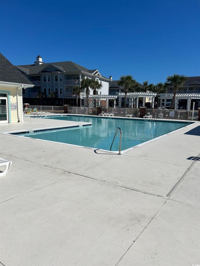 Pool featuring a patio area and fence | Image 26