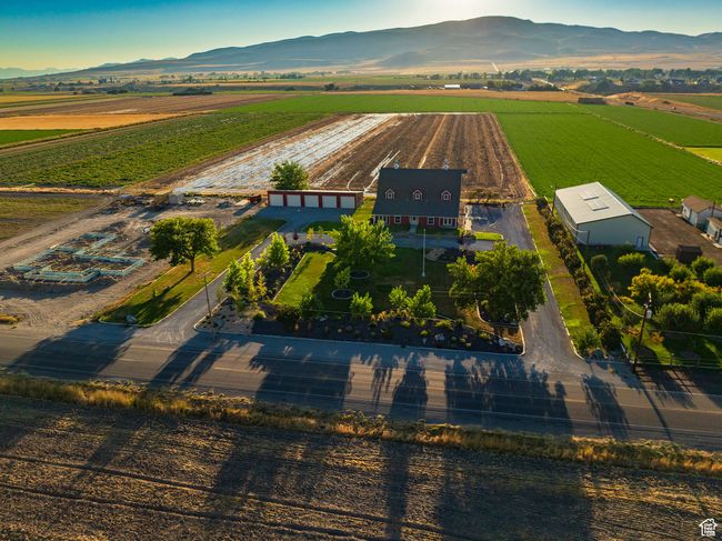 Aerial view of sparsely populated area featuring mountains and abundant farmland | Image 13