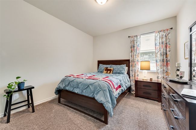 Carpeted bedroom featuring baseboards | Image 23