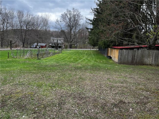 View of yard featuring fence | Image 24