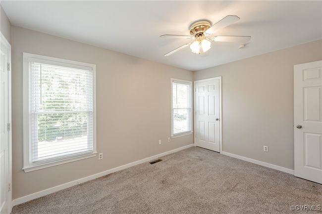 Bedroom 3 with visible vents, carpet flooring, and multiple windows | Image 39