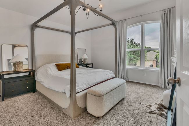 Bedroom featuring carpet flooring, baseboards, and a chandelier | Image 22