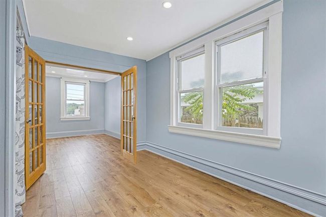 Empty room with french doors and light hardwood / wood-style flooring | Image 10