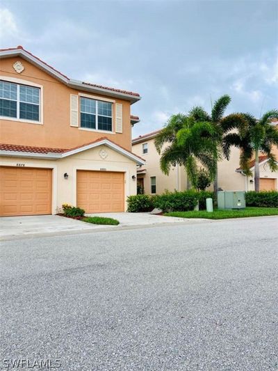 View of front facade with a garage | Image 1