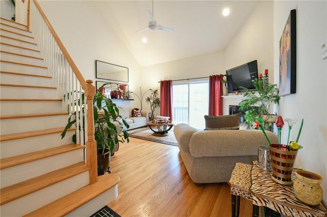 Steps from the dining room, enter the spacious, two-story living room. | Image 5