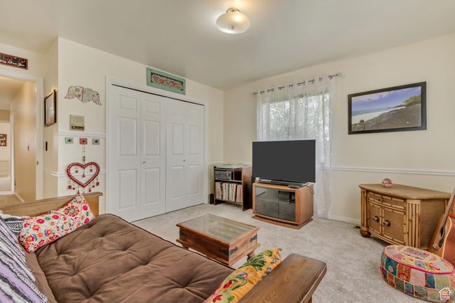 Living room featuring light carpet | Image 34