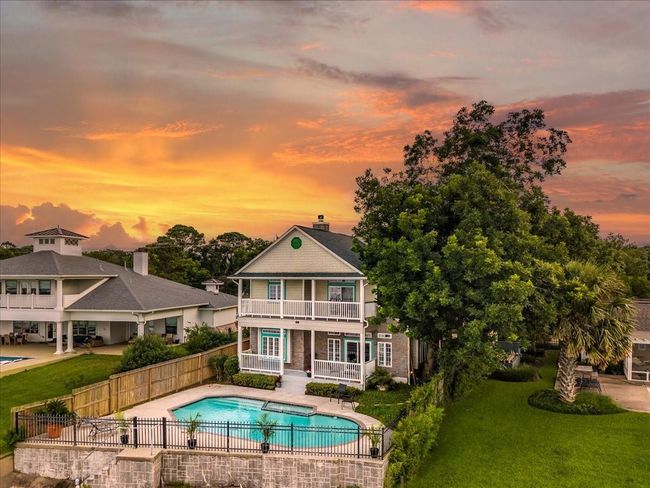 Bayfront pool is the ultimate place to relax with views of boats, birds, and dolphins. | Image 7