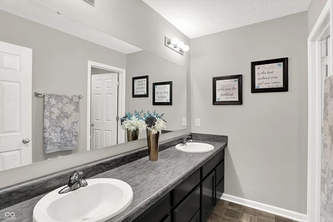 Third Full Bath upstairs with dual sinks and separate water closet for toilet and bath/shower combo | Image 34