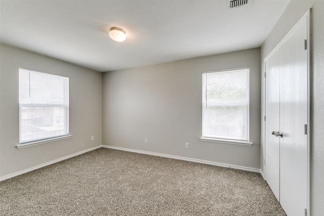View of carpeted spare room | Image 16