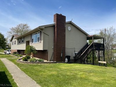 View of side of home with a lawn | Image 2