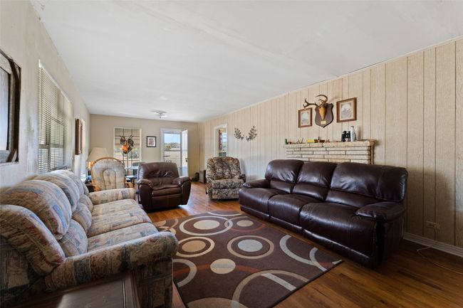 Living area with wood finished floors | Image 5